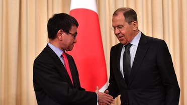 Russian FM Sergei Lavrov shakes hands with Japanese FM Taro Kono after their news conference in Moscow. (AFP)