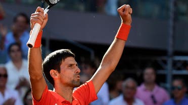 Novak Djokovic celebrates after defeating Dominic Thiem during their ATP Madrid Open semi-final tennis match at the Caja Magica in Madrid on May 11, 2019. (AFP)