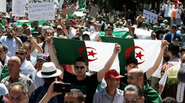 Algerian protesters march with national flags during an anti-government demonstration in the capital Algiers on May 10, 2019. (AFP)