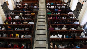 Sri Lankan Catholic devotees pray during a mass at the St. Theresa’s church as the Catholic churches hold services again. (AFP)