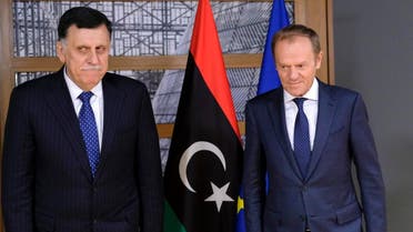 President of the European Council, Donald Tusk (R) welcomes Libyan Prime Minister Fayez al-Sarraj prior to a meeting in Brussels on May 13, 2019. (AFP)