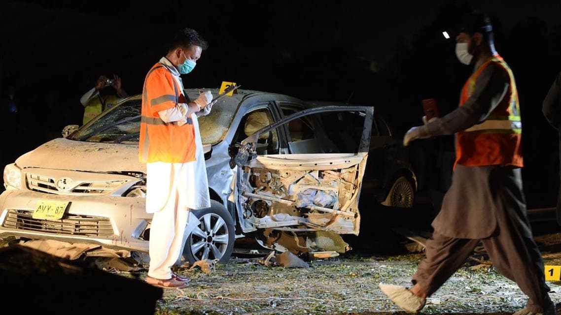Pakistani security officials examine the site of a bomb blast in Quetta on May 13, 2019. (AFP)