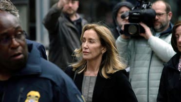 Felicity Huffman arrives at federal court Monday, May 13, 2019, in Boston, where she pled guilty to charges in a nationwide college admissions bribery scandal. (AP)