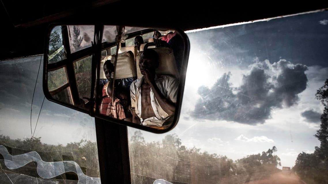 South Sudanese refugees transported by bus from the border of South Sudan to a refugees settlement site in Democratic republic of the Congo (DRC) are seen in the rear-view mirror of the bus on May 10, 2019. (AFP)