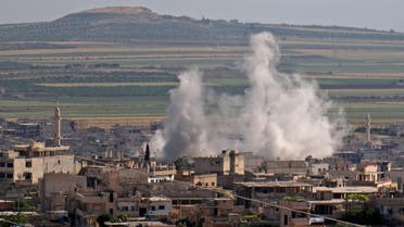 Smoke billows following regime bombardment on the town of Khan Shaykhun in the southern countryside of the rebel-held Idlib province on May 14, 2019. (AFP)