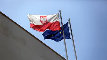 Poland’s flag flutters near the European Union flag on the building of the Polish Embassy in Tel Aviv on May 15, 2019. (Reuters)