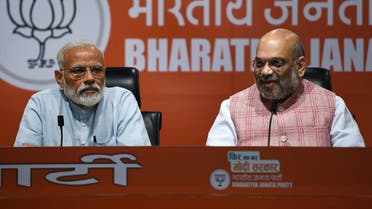Indian Prime Minister Narendra Modi (L) and Bharatiya Janata Party president Amit Shah take part in a press conference in New Delhi on May 17, 2019. (AFP)