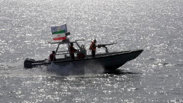 An Iranian Revolutionary Guard speedboat escorts a passenger ship. (Illustrative photo: AP)