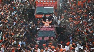 India’s Prime Minister Narendra Modi waves towards his supporters during a roadshow in Varanasi, India, April 25, 2019. (Reuters)
