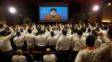 Hezbollah scouts raise their fists and cheer as they listen to a speech by Hezbollah leader Hassan Nasrallah. (File photo: AP)
