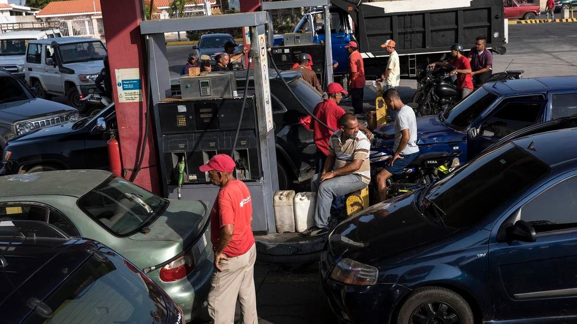 People who had been waiting in long lines fill up with gas at a fuel station in Cabimas, Venezuela, Wednesday, May 15, 2019. (AP)