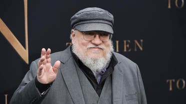 Author George R.R. Martin waves to photographers at the premiere of the film "Tolkien," at the Regency Village Theatre. (AP)