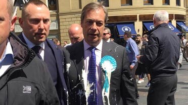 Brexit Party leader Nigel Farage after being hit with a milkshake during a campaign walkabout for the upcoming European elections in Newcastle, England, Monday May 20, 2019. (Tom Wilkinson/PA via AP)