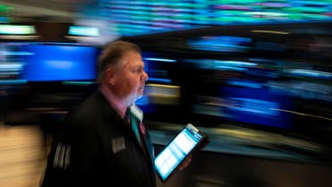 Traders work after the opening bell at the New York Stock Exchange (NYSE) on May 1, 2019. (AFP)