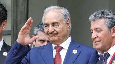 Libya Chief of Staff, Marshall Khalifa Haftar, whose rival Libyan National Army dominates the country's east, gestures as he stands on the steps of the Elysee Palace following the International conference on Libya on May 29, 2018. (AFP)