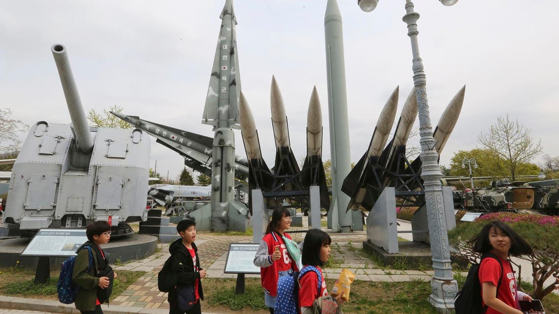 School students pass by a mock North and South Korean missiles at Korea War Memorial Museum in Seoul on April 18, 2019. (AP)
