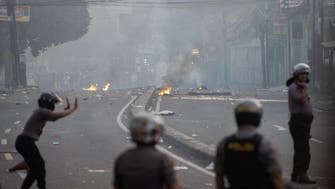 Six dead in Indonesia riots, government restricts social media