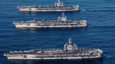 File photo of the aircraft carriers USS Ronald Reagan (CVN 76), USS Theodore Roosevelt (CVN 71) and USS Nimitz (CVN 68) conducting operations as part of a three-carrier strike force exercise in western Pacific. (Reuters)
