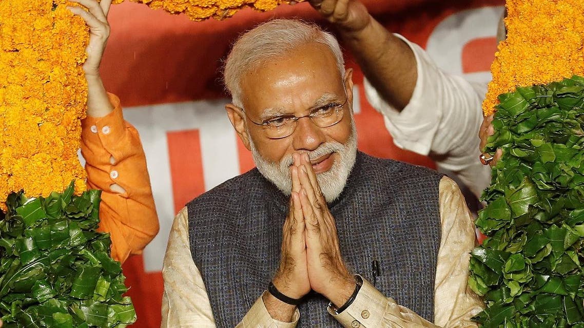 Indian Prime Minister Narendra Modi gestures as he is presented with a garland by Bharatiya Janata Party (BJP) leaders after the election results in New Delhi, India, May 23, 2019. (Reuters