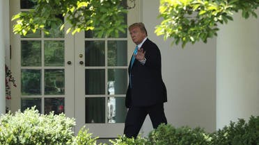 President Donald Trump waves as he walks towards the Oval Office in Washington, Thursday, May 23, 2019, after visiting the annual Flags In ceremony at Arlington National Cemetery. (AP)