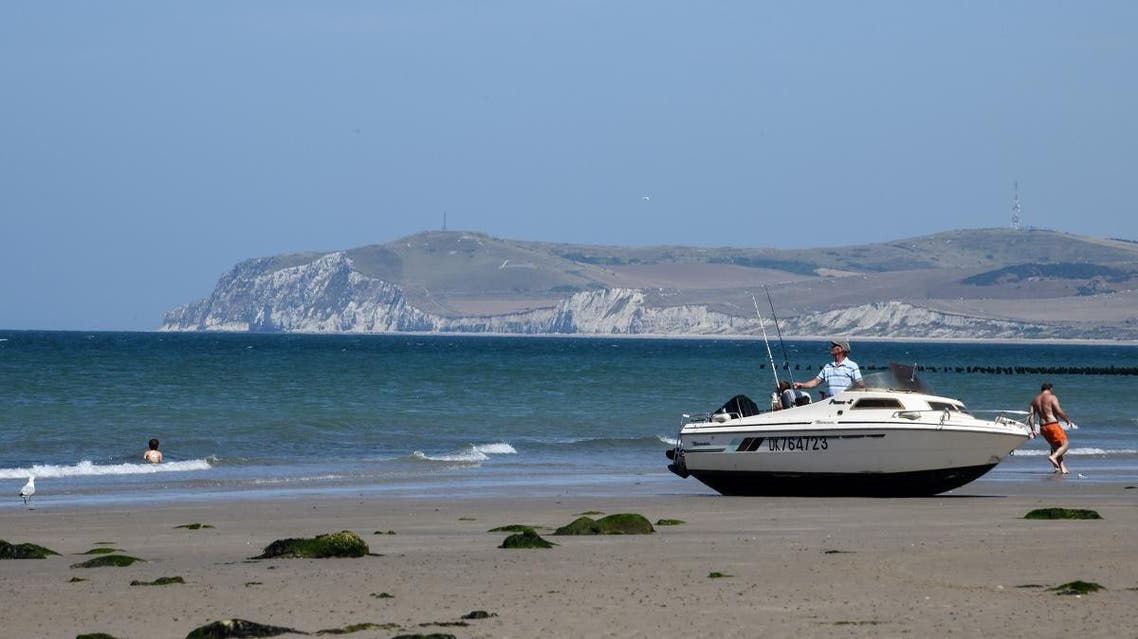 This photo taken on July 23, 2018 shows a stranded pleasure boat on the Cap Gris Nez beach, near Boulogne sur Mer, northern France. DENIS CHARLET / AFP