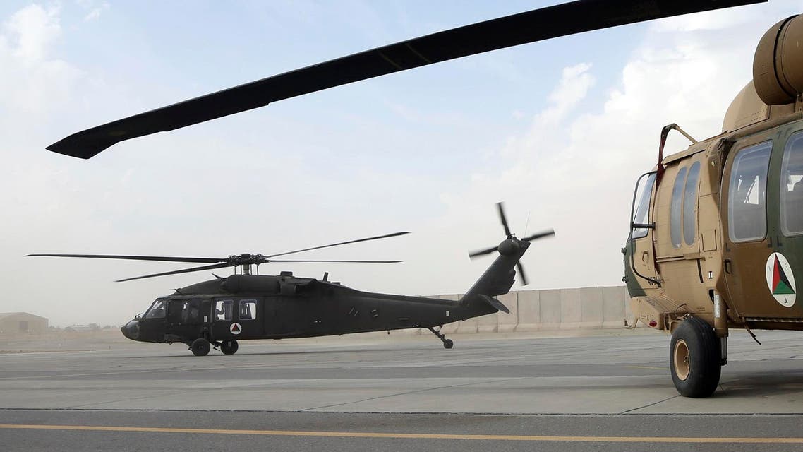 In this Monday, March 19, 2018, photo, UH-60 Black Hawk helicopter carrying US advisers and Afghan trainees take off at Kandahar Air Field, Afghanistan. AP