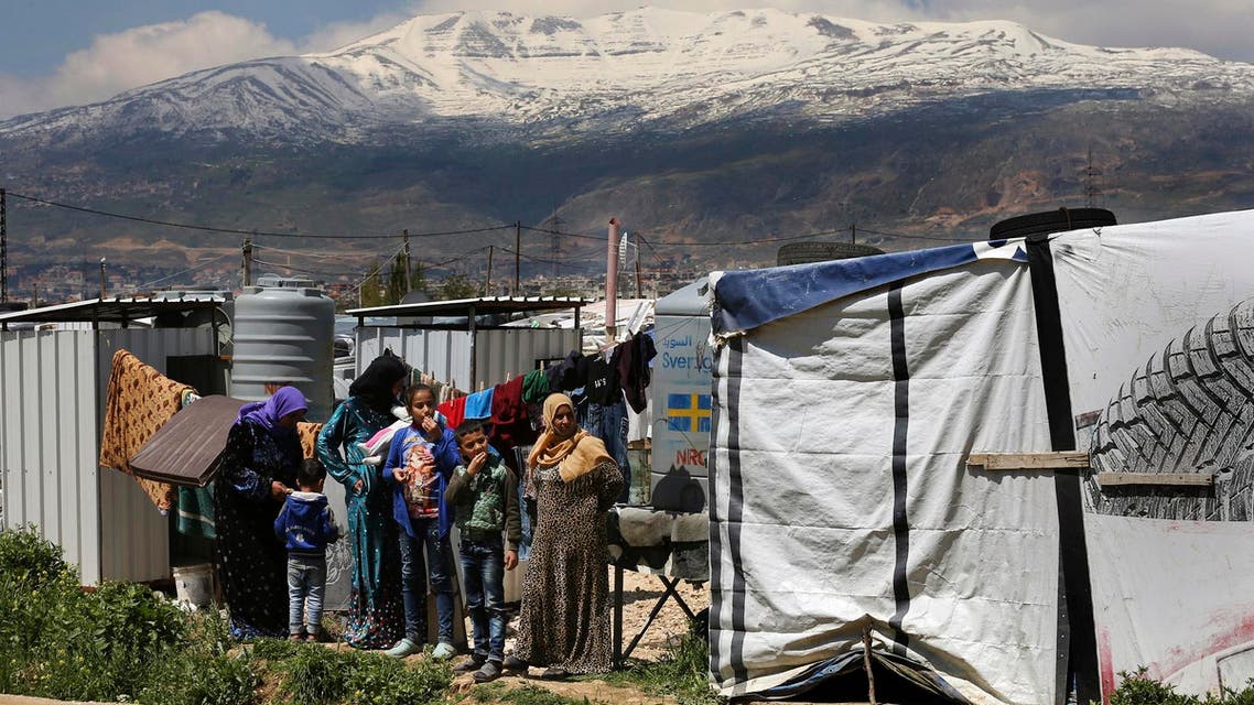 Syrian refugees watch the opening ceremony of a school for Syrian refugees, in the Bekaa valley town of Saadnayel, east Lebanon. (File photo: AP)