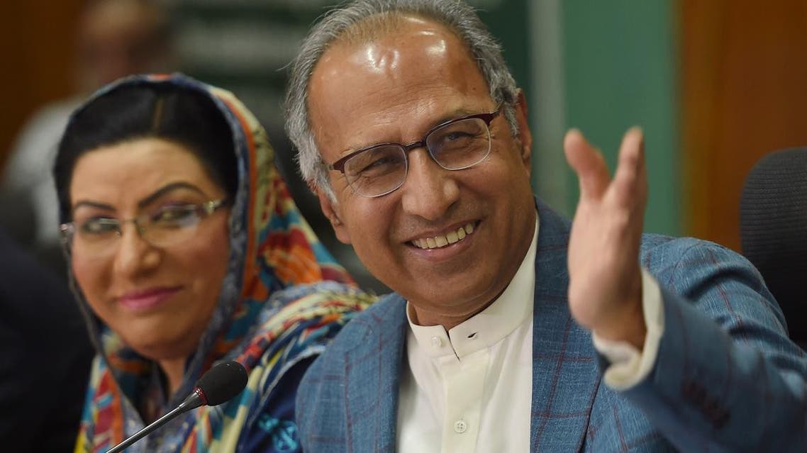 Advisor to Prime Minister Imran Khan on Finance, Revenue and Economic Affairs Abdul Hafeez Shaikh (L) gestures during a press conference next to special assistant to the Prime Minister for Information and Broadcasting Firdous Ashiq Awan, in Islamabad on May 25, 2019. (AFP)