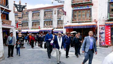 US Ambassador to China Terry Branstad (center), walks along a street in Lhasa in western China’s Tibet Autonomous Region. (AP)