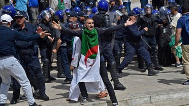 An Algerian protester reacts during an anti-government demonstration outside La Grande Poste (main post office) in the centre of the capital Algiers. (AFP)