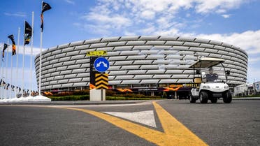 A golf car drives outside the Baku Olympic stadium on May 27, 2019 on the eve of the UEFA Europa league final match between Arsenal and Chelsea, in Baku, Azerbaijan. (AFP)