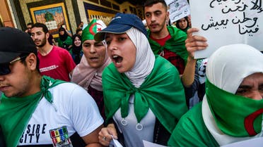 Algerian students draped in national flags shout slogans as they take part in a demonstration in Algiers on May 28, 2019. (AFP)