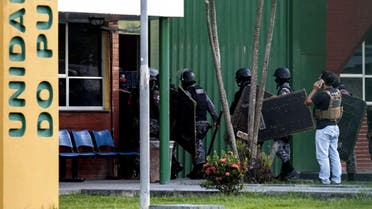 Brazilian riot police prepare to invade the Puraquequara Prison facility at Bela Vista community on May 27. (AFP)
