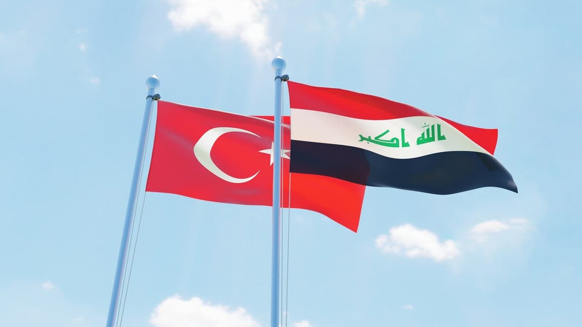 Iraq and Turkey two flags together textile cloth fabric texture - Stock image