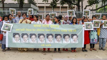 In this photo taken on April 12, 2019 Bangladeshi women hold banners and photographs of schoolgirl Nusrat Jahan Rafi at a protest in Dhaka. (File photo: AFP)