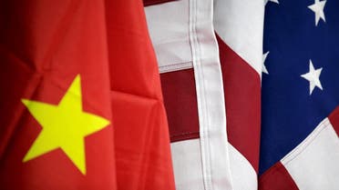 Flags of US and China are displayed at AICC’s booth during China International Fair for Trade in Services in Beijing, May 28, 2019. (Reuters) 