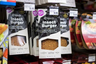 Packs of pre-cocked insect burgers based on protein-rich mealworm are seen on a supermarket shelf on August 21, 2017 in Geneva. Switzerland - AFP
