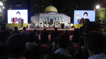 Nasrallah, transmitted on two large screens with a replica of the Dome of the Rock mosque, during the al-Quds (Jerusalem) International Day, in a southern suburb of the capital Beirut on May 31, 2019. (AFP)
