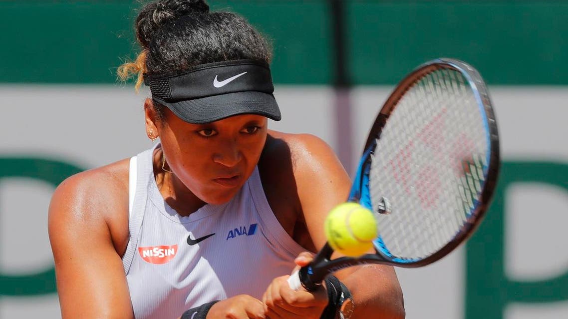 Naomi Osaka plays a shot against Katerina Siniakova of the Czech Republic during their third round match of the French Open tennis tournament at the Roland Garros stadium in Paris, on June 1, 2019.  (AP)