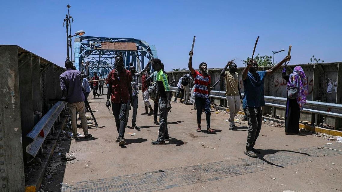 Protesters walk towards the sitin protest outside the Sudanese military headquarters, in Khartoum, Sudan, Tuesday, May 14, 2019. (AP)