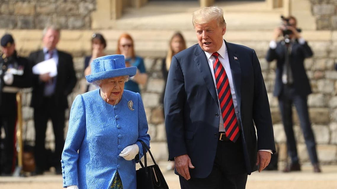 US President Donald Trump (R) and Britain's Queen Elizabeth II (L) leave the Quadrangle after inspecting a Guard of Honour during a ceremonial welcome at Windsor Castle in Windsor, west of London, on July 13, 2018. (AFP)
