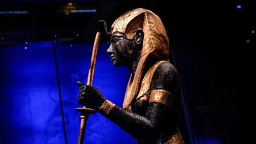 A sculpture depicting Tutankhamun displayed during the exhibition Tutankhamun, Treasures of the Golden Pharaoh at La Villette, in Paris on March 21, 2019. (AFP)