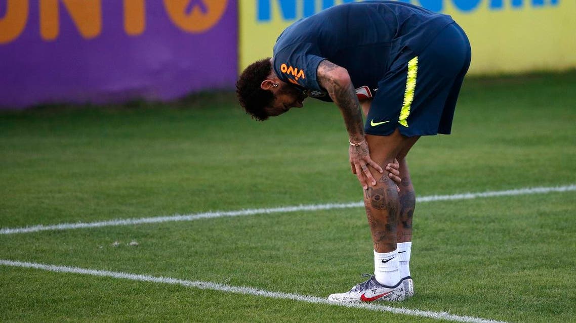 Brazil's soccer player Neymar touches his left knee during a practice session at the Granja Comary training center ahead of the Copa America tournament, in Teresopolis, Brazil, Tuesday, May 28, 2019. (AP)