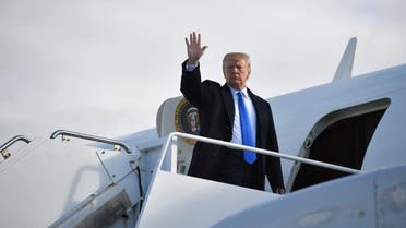 US President Donald Trump waves before boarding Air Force One at Shannon Airport in Shannon, Ireland, on June 6, 2019 and fly to Normandy, France, to attend the 75th D-Day Anniversary. (AFP)