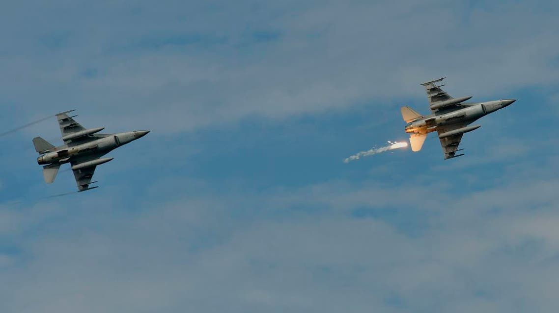 A US-made F-16 fighter jet (R) launches a flare during the 35th Han Kuang (Han Glory) military drill in southern Taiwan's Pingtung county on May 30, 2019. (AFP)