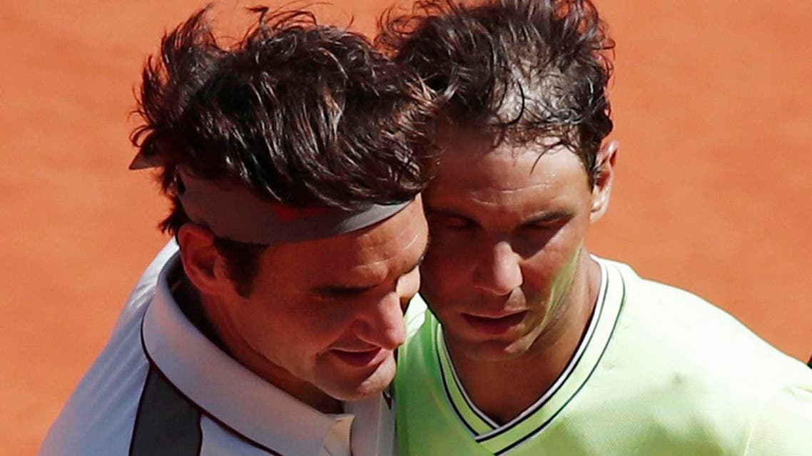 Switzerland’s Roger Federer and Spain’s Rafael Nadal after their semifinal match at the French Open on June 7, 2019. (Reuters)