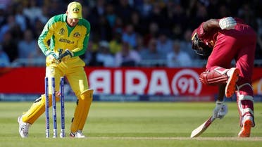 West Indies' Jason Holder completes a run as Australia's Alex Carey attempts to stump him. (Reuters)