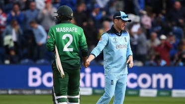 Bangladesh's captain Mashrafe Mortaza (L) shakes hands with England's captain Eoin Morgan after the 2019 Cricket World Cup group stage match between England and Bangladesh at Sophia Gardens stadium in Cardiff, south Wales, on June 8, 2019, as England beat Bangladesh by 106 runs. (AFP)