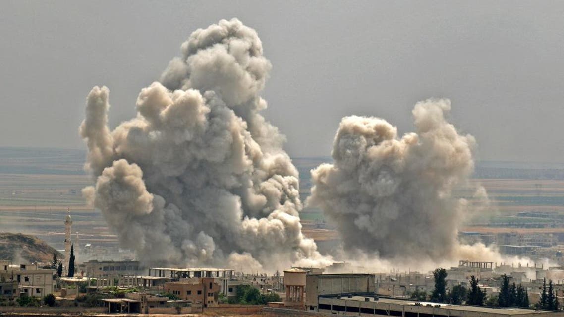 Plumes of smoke rise following reported Syrian government forces' bombardment on the town of Khan Sheikhun, countryside of Idlib. (AFP)