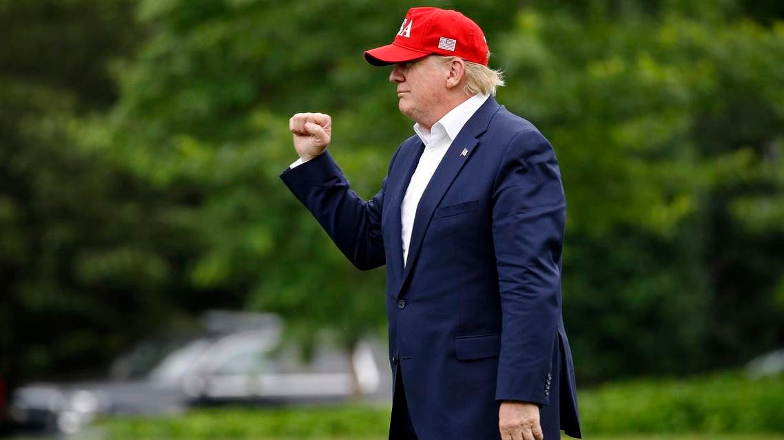 President Donald Trump gestures after stepping off Marine One on the South Lawn of the White House, on June 7, 2019, in Washington. Trump is returning from a trip to Europe. (AP)